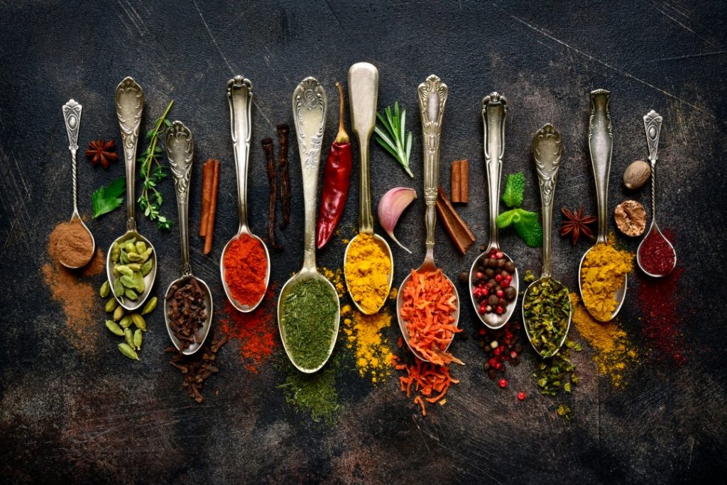 colourful spice blends on arranged teaspoons